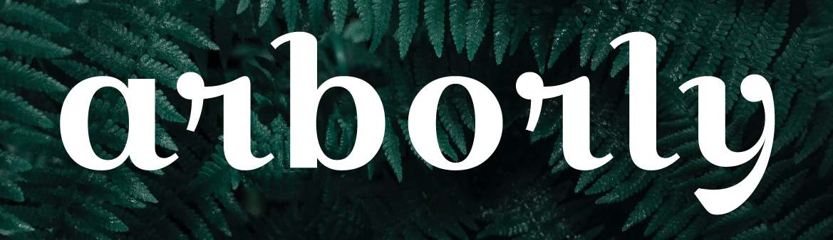 An image showing the word Arborly, in white font over dark green leaves.
