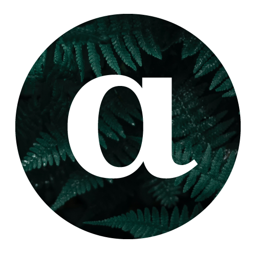 An image showing the letter A, in white font, over a circle of dark green leaves.